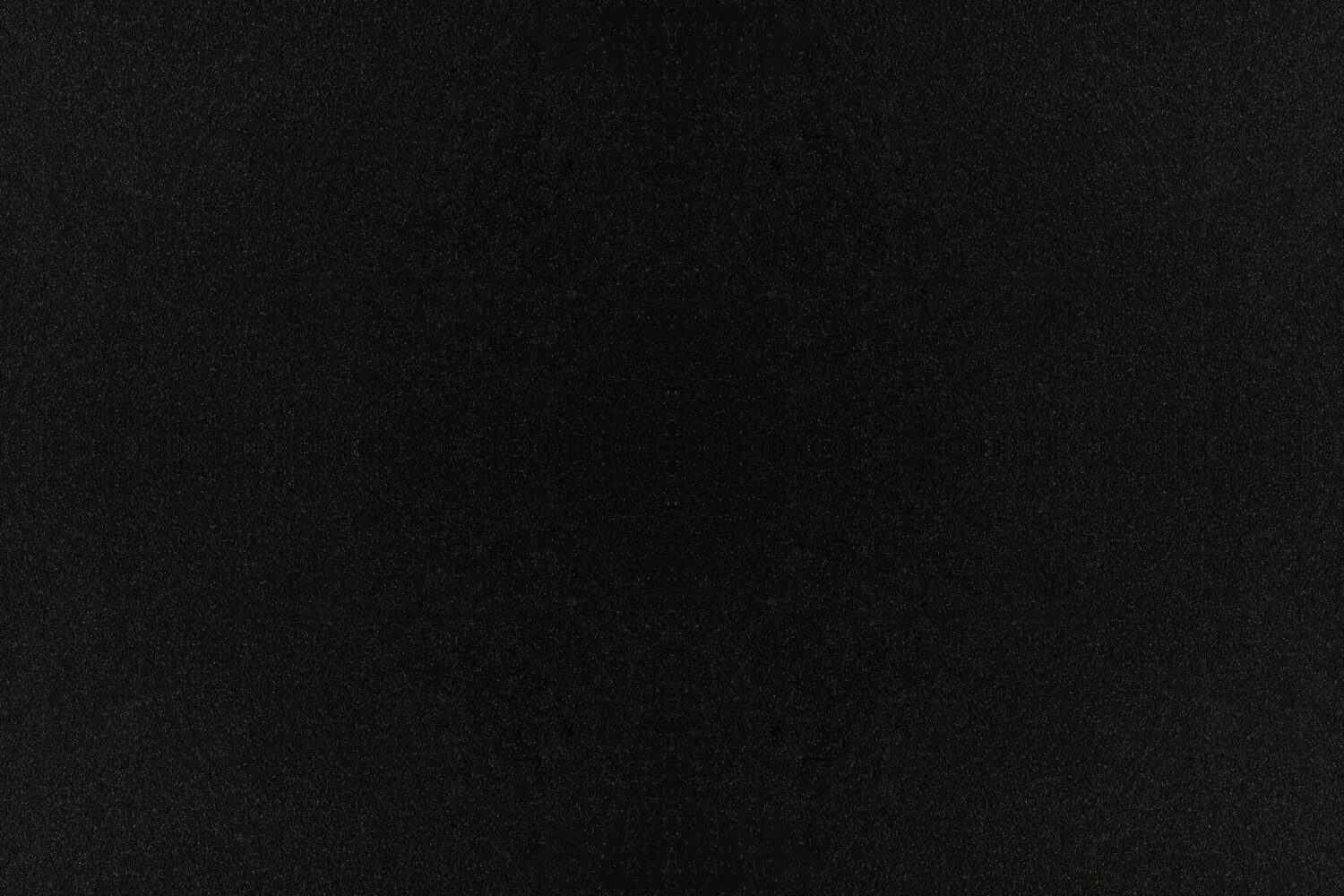 A plain black texture with subtle grain.